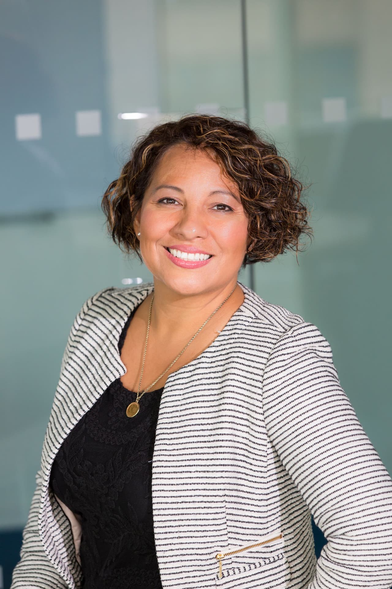 An African American professional in a polished office setting, representing workplace notary support for businesses and employers.